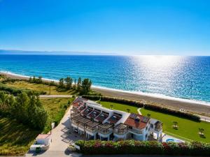 an aerial view of a building next to the ocean at Villa Myla in Kato Yialia