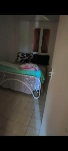 a small room with a bed in a room at Paradis Oyonnax in Bellignat