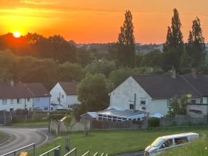 a sunset over houses in a residential neighbourhood at Ilsyn Grove in Brislington