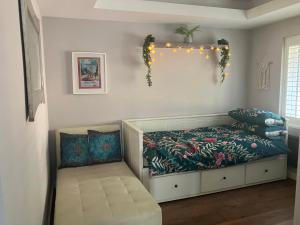 a childs bedroom with a bed with a floral bedspread at Ilsyn Grove in Brislington