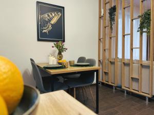 a table in a room with chairs and a table with at Apartament Słoneczny 31 in Czechowice-Dziedzice +41 photos