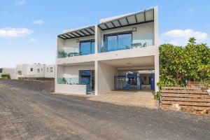 a house on the side of a road at Callao Beach 9 in Arrieta