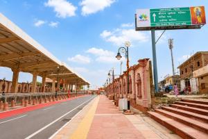 an empty street with a sign on the side of the road at Hotel Ramkesarrai in Ayodhya