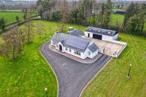 an aerial view of a house with a solar roof at Turner's Corner by Escape Ordinary in Aghadowey