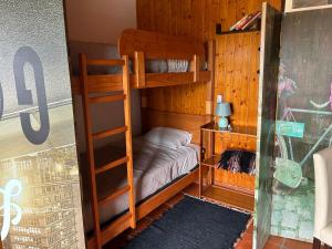 a bedroom with two bunk beds and a ladder at Casa do Adro in Viana do Castelo +42 photos