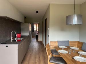 a kitchen and dining room with a table and chairs at Haus Casimir in Reith im Alpbachtal +27 photos
