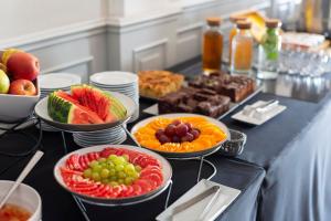 a table topped with bowls of fruit and plates of food at Hotel Duo Spa in Janów Lubelski +51 photos