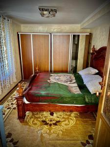 a bedroom with a bed in a room at Chashma in Ishkashim