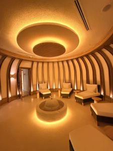 a living room with chairs and a fire pit at Cityloft 175 in Istanbul +113 photos