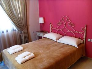 Postel nebo postele na pokoji v ubytování Garden Villa