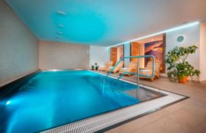a large swimming pool in a hotel room at Apartman Emma in Liptovský Ján