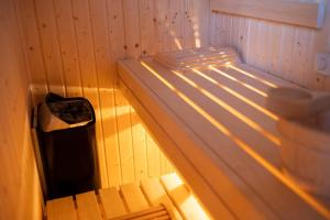 a small room with a small bed in a room at Landhaus Schneeberg AusZeit am Küppel & Bright Collection in Gersfeld