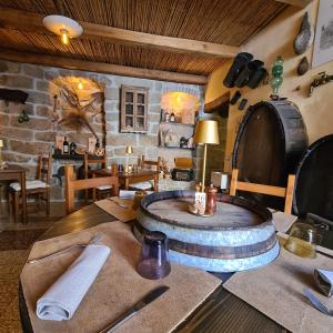 a kitchen with a table with a barrel on it at Al Vecchio Corso B&B in Tempio Pausania