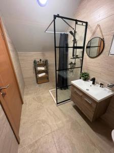 a bathroom with a sink and a mirror at Glamping Lake Escape in Virpazar +41 photos