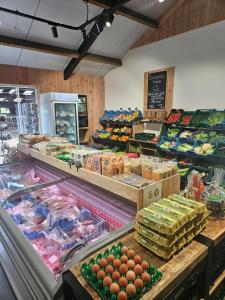 a grocery store filled with lots of fruits and vegetables at Erve iemhorst in Losser
