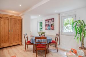 a dining room with a table and chairs at Villa Rosa in Offenburg