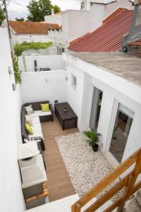 an aerial view of a balcony of a white building at Melissa's house in Amora