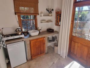 a kitchen with a sink and a counter top at Konka Guest Farm in Carnarvon