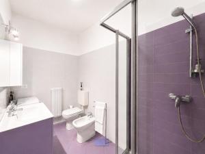 a bathroom with a toilet and a sink and a shower at Bella Vita Stays Easy in Sondrio +12 photos