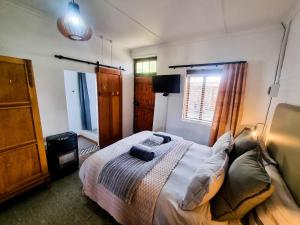 a bedroom with a bed and a window at Konka Guest Farm in Carnarvon +50 photos