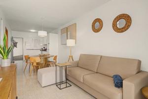 a living room with a couch and a table at Callao Beach 3 in Arrieta