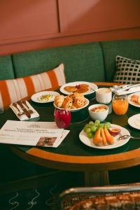 a table with plates of food on top at Les Cimes Bleues in La Baule