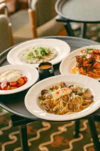 a table with four plates of food on it at Les Cimes Bleues in La Baule +152 photos