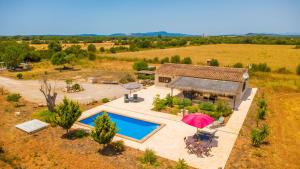 an aerial view of a house with a swimming pool at Son Fred in Felanitx