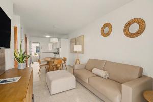 a living room with a couch and a table at Callao Beach 1 in Arrieta