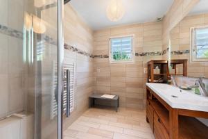 a bathroom with a shower and a sink at Ker Family in Arzon