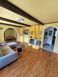 a living room with a couch and a table at Apartma Regrat in Lesce