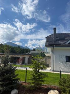 a view of a house with solar panels on the roof at Villa White Stone in Starý Smokovec