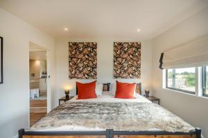 a bedroom with a large bed with red pillows at 2 Bed in Overton oc-k45280 in Overton +30 photos