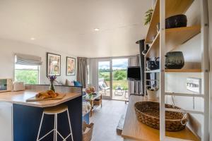a kitchen and living room with a counter and a table at 2 Bed in Overton oc-k45280 in Overton