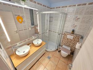 a bathroom with a sink and a shower at Villa Dvojac Holiday house with Jacuzzi and grill in Jadranovo +36 photos