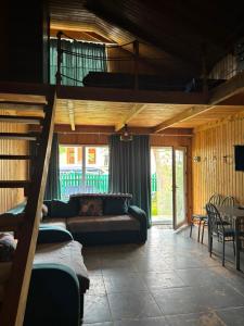 a living room with a bunk bed and a couch at Valdi Guest Shekvetili in Shekhvetili