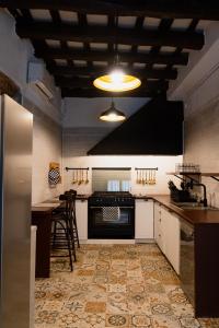 a kitchen with a stove and a counter top at Can marques in Cunit