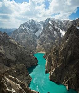 a mountain lake in the middle of a mountain range at Kel-Suu Manap in Kol-Suu
