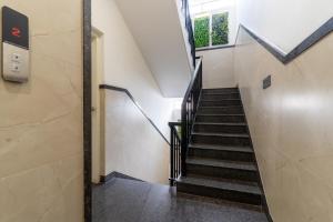a staircase in a building with a window at Hotel metro grand in Bangalore