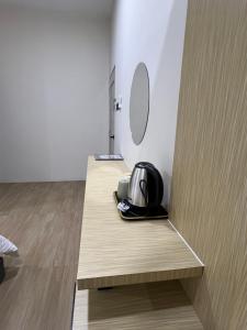 a toaster sitting on a wooden counter in a room at Luminara Villa Kuala Besut in Kampung Kuala Besut +52 photos