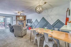 a dining room with a table and chairs at Hike, Golf & Explore: Ruidoso Retreat w/ Deck! in Ruidoso