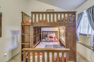 a wooden bunk bed in a childs bedroom at Hike, Golf & Explore: Ruidoso Retreat w/ Deck! in Ruidoso