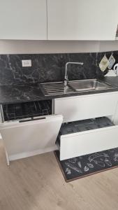 a kitchen with a sink and a counter top at CasaLù in Lanciano +45 photos