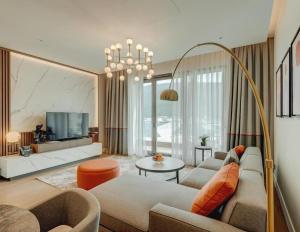 a living room with a couch and a tv at Portonovi Marina in Kumbor
