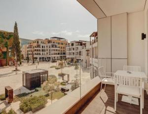 a balcony with a view of a city at Portonovi Marina in Kumbor