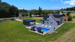 an overhead view of a house with a swimming pool at Villa Jovičić in Prijedor