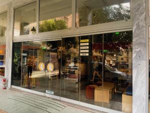 a store front window of a furniture store at Yellowsquare Athens in Athens