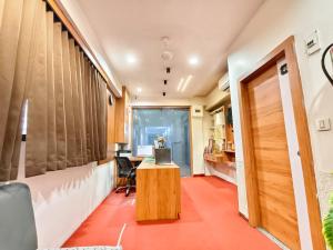 an office with a desk and a chair in a room at Hotel Royal Relax in Gandhinagar