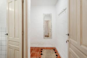 a bathroom with a mirror and a tile floor at Casa Veronica in Arona +26 photos