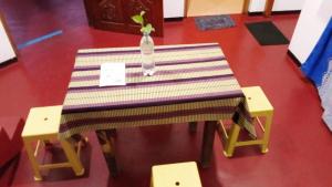 a table with a vase sitting on top of it at Zeenath Villa - Arugambay in Arugam Bay